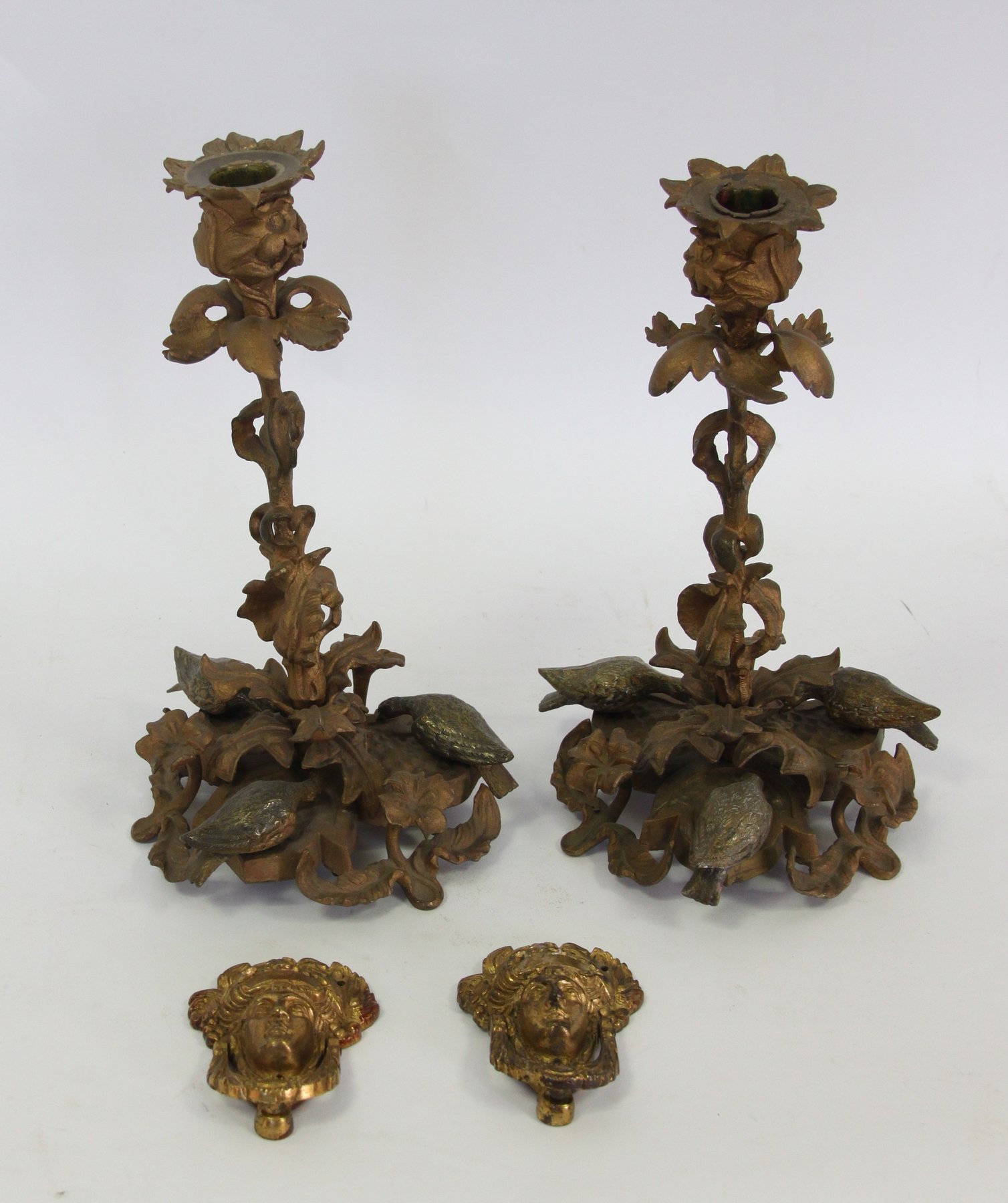 Appraisal: A pair of gilt metal candlesticks each of naturalistic form