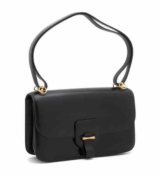 Appraisal: An Hermes 'Dolly' Black Calf Bag with long shoulder strap