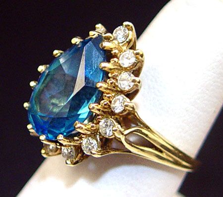 Appraisal: CT LONDON BLUE TOPAZ WITH DIAMONDS RING K yellow gold