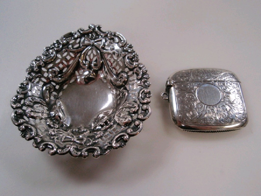 Appraisal: A silver vesta case Birmingham together with a pierced rococo