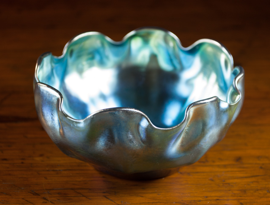 Appraisal: LOUIS COMFORT TIFFANY ART GLASS BOWL blue iridescence with ruffled