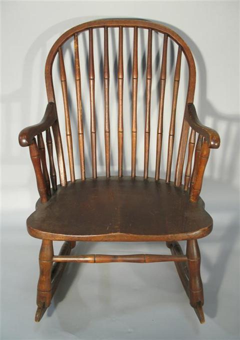 Appraisal: SMALL WINDSOR STYLE ROCKING CHAIR the arched back with turned