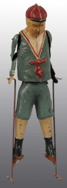 Appraisal: Tin Hand-Painted Boy on Stilts Wind-Up Toy Description German Working