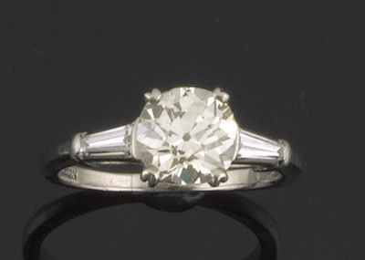 Appraisal: A diamond solitaire ring The old circular cut diamond weighs