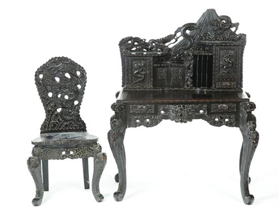 Appraisal: CARVED DESK AND CHAIR China th century teakwood Carved writing