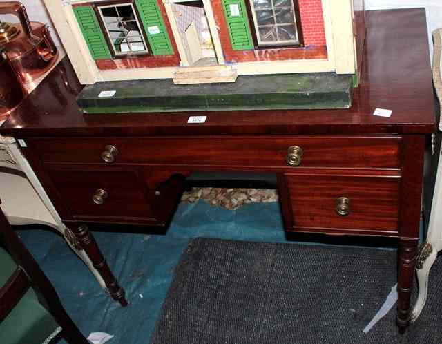 Appraisal: A GEORGE IV MAHOGANY RECTANGULAR SIDE TABLE fitted one long