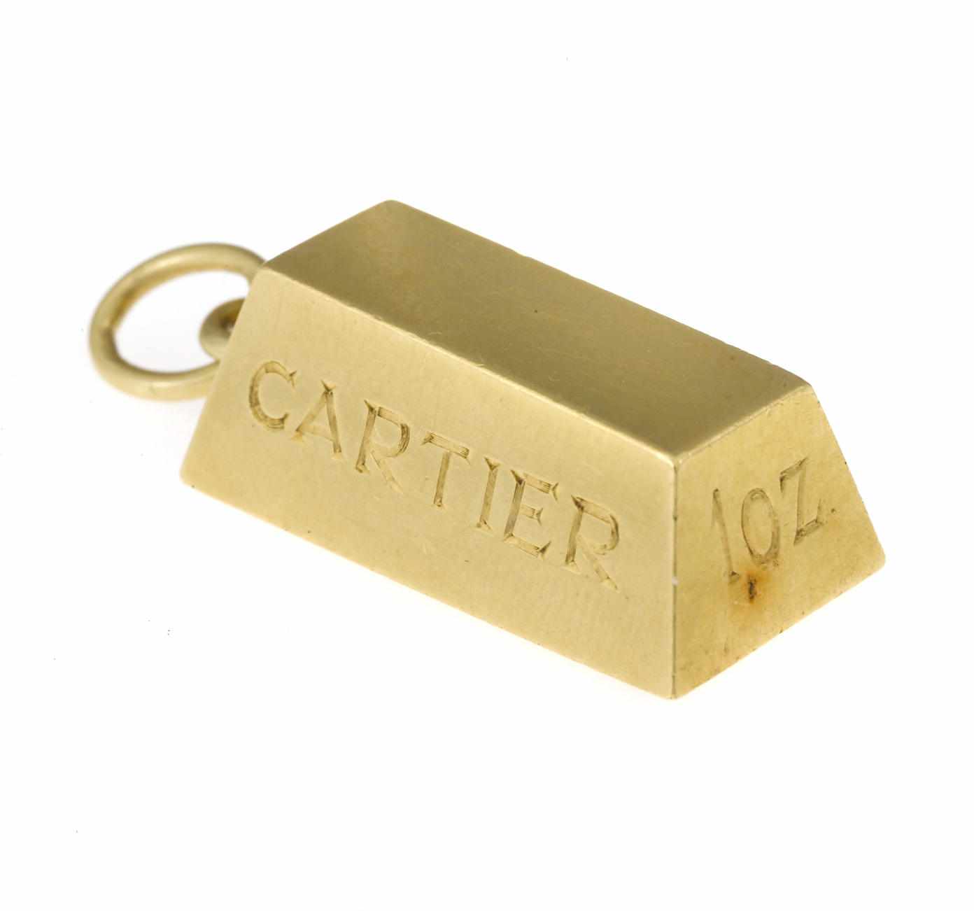 Appraisal: An eighteen karat gold '' oz '' ingot pendant Cartier