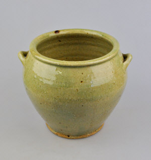 Appraisal: A Chinese stoneware storage vessel with two strap handles celedon