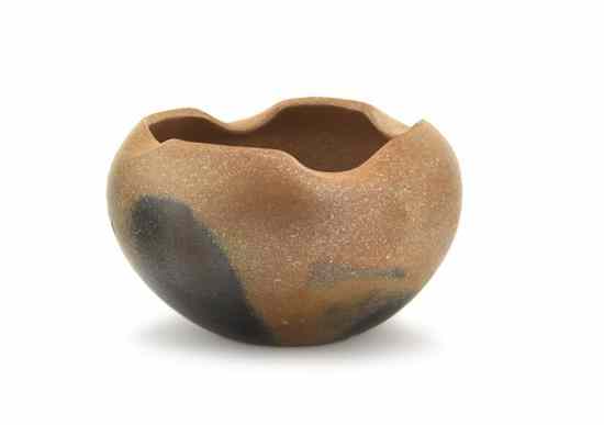 Appraisal: A Taos Micaceous Clay Bowl having a scalloped edge and