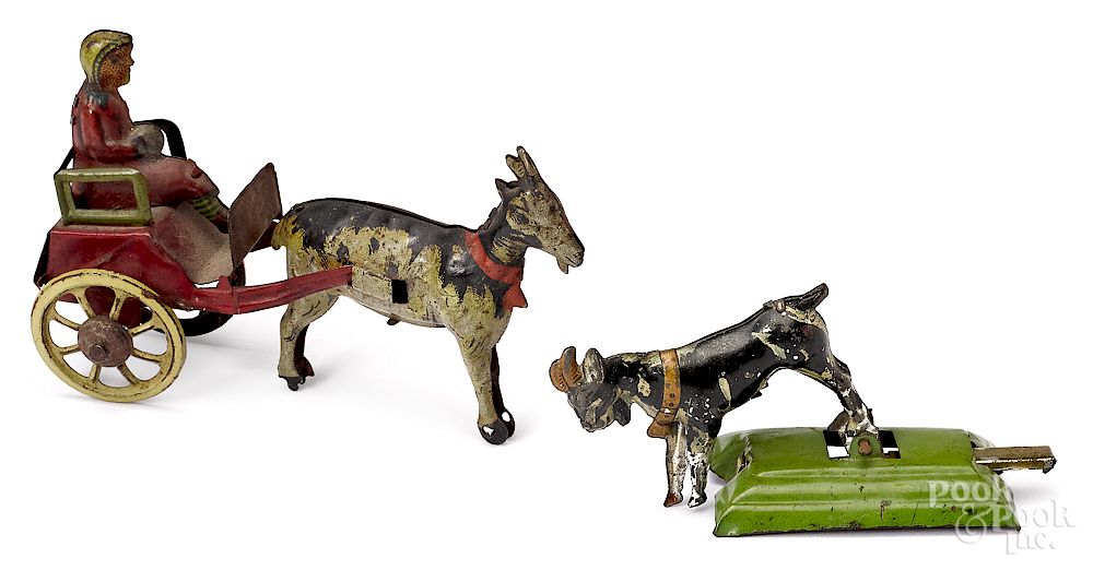 Appraisal: Two tin lithograph goat penny toys Two tin lithograph goat