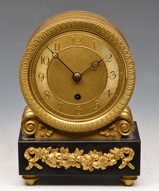 Appraisal: A REGENCY GILT BRASS DRUM HEAD MANTEL TIMEPIECE the matt