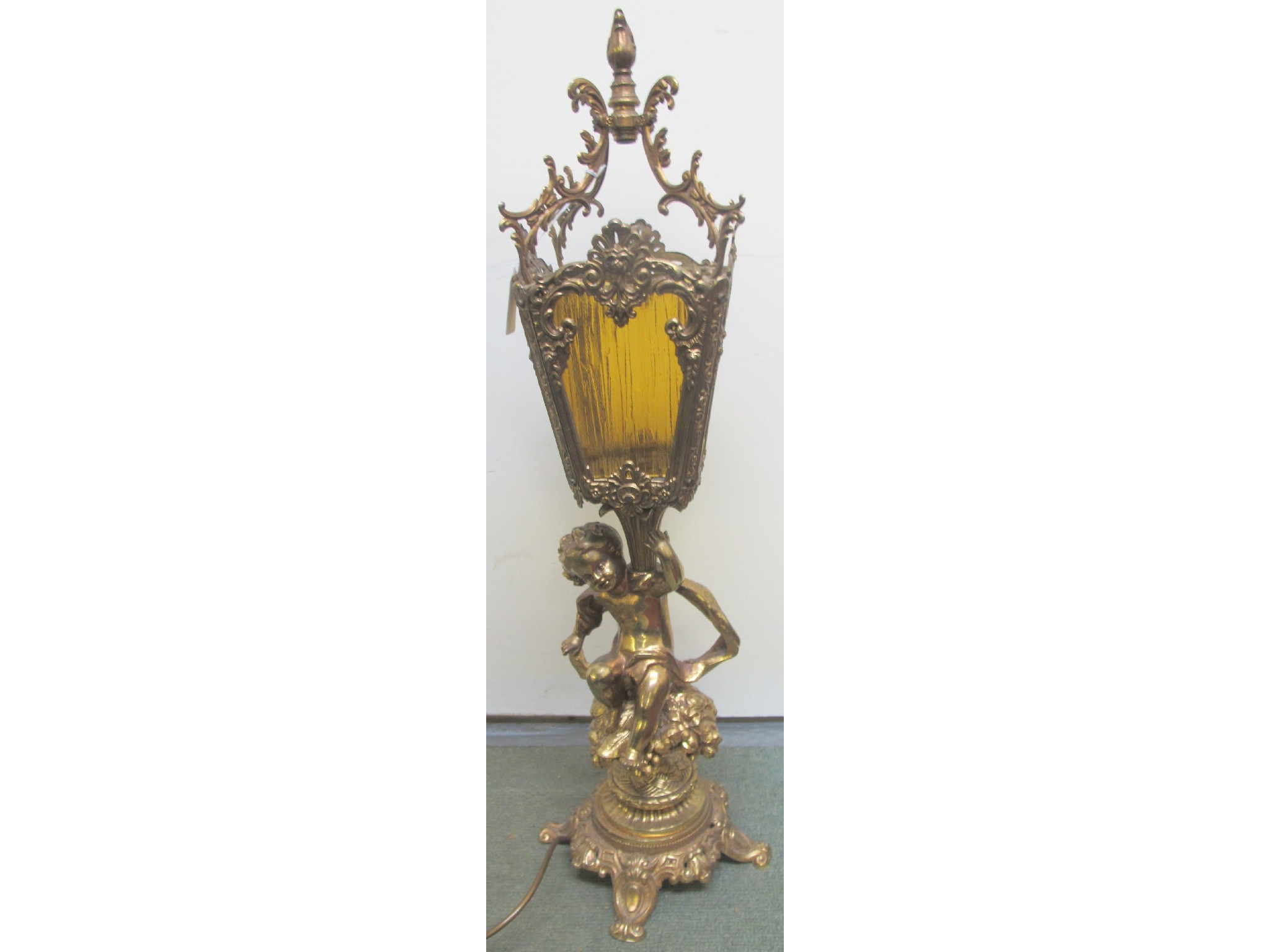 Appraisal: A gilt cherub brass table lamp