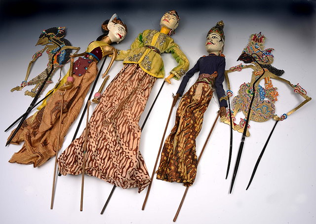 Appraisal: Collection of Siamese carved wood and paper silhouette puppetsand other