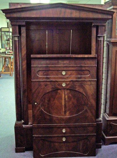 Appraisal: A satin mahogany wardrobe the architectural pediment above a single