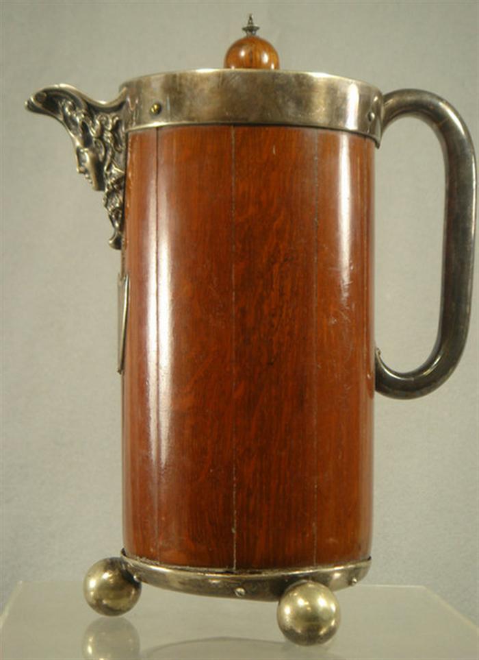 Appraisal: Oak and plated silver insulated tankard ladies head on spout