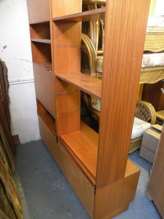 Appraisal: A 'G' plan teak bookcase room unit with sliding doors