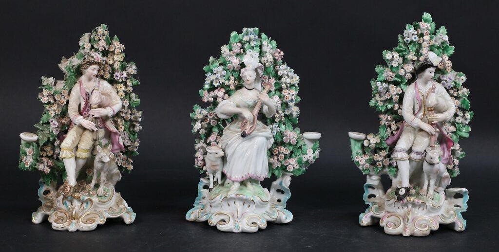 Appraisal: Chelsea style figural bocage candlesticks pair and one single Tallest