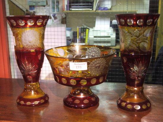 Appraisal: A GARNITURE OF BOHEMIAN RUBY AND AMBER GLASS to include