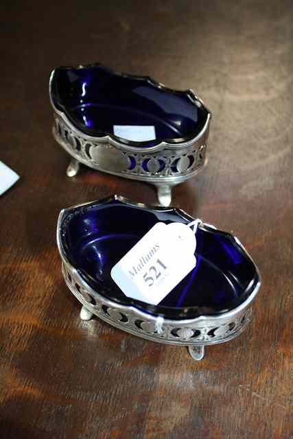 Appraisal: A PAIR OF GEORGE III SILVER SALTS oval with shaped