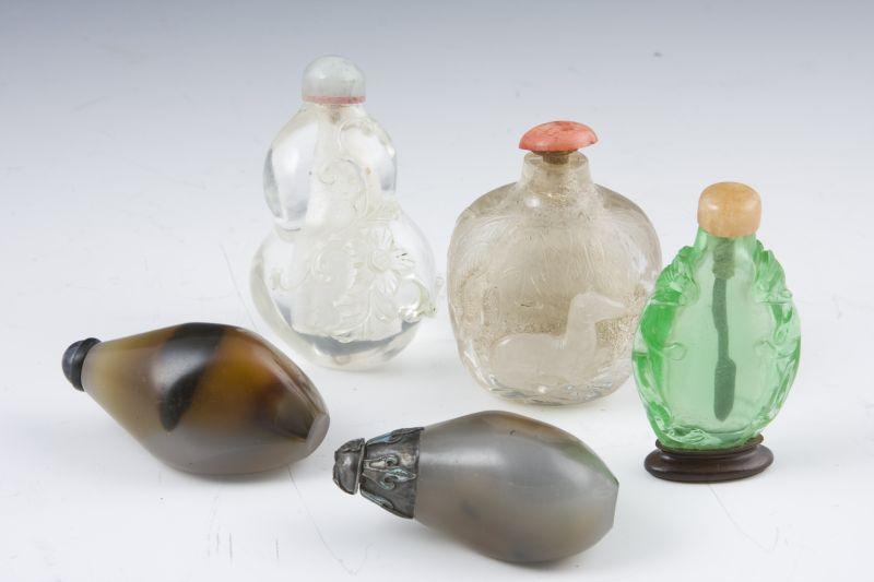 Appraisal: Five Chinese Carved Stone Snuff Bottles including tumbled stone snuff