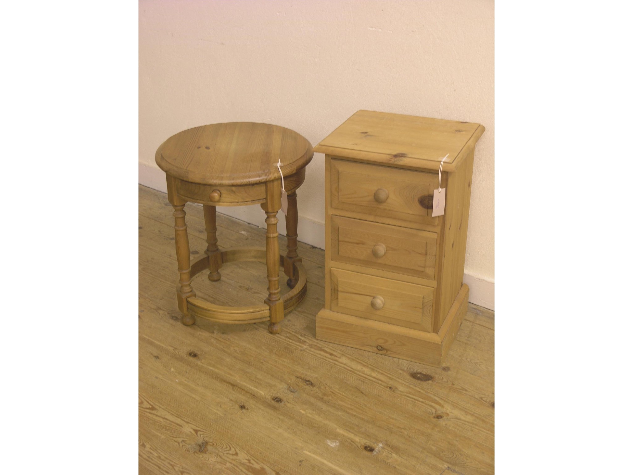 Appraisal: A pine bedside chest three drawers ft in and a