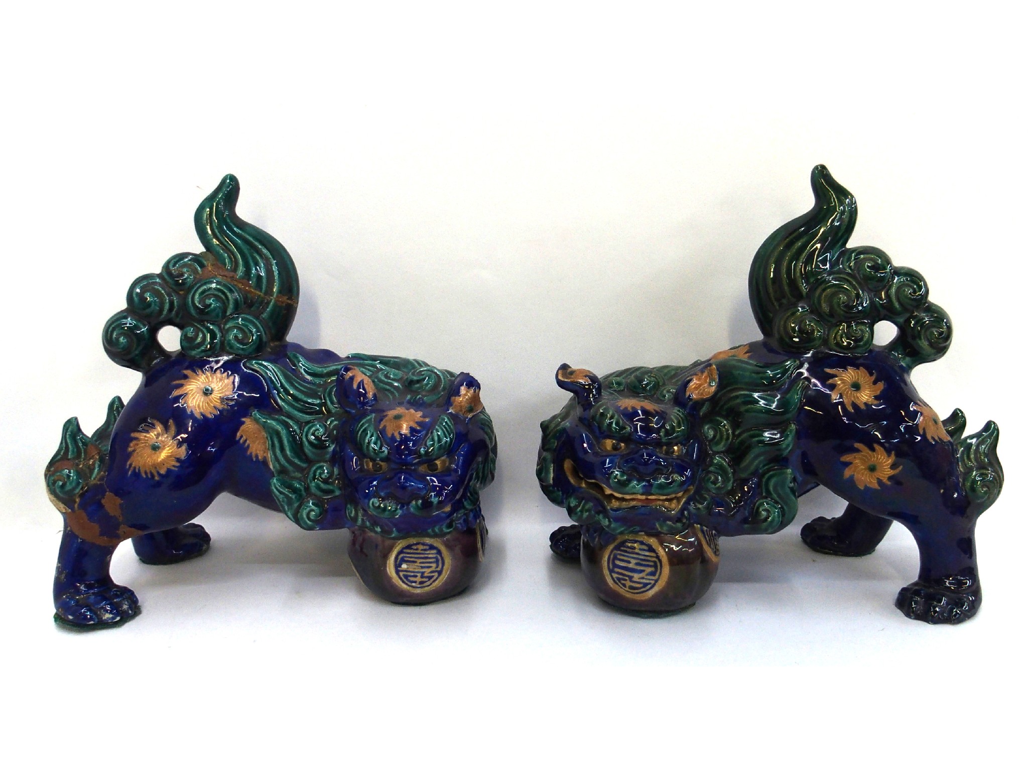 Appraisal: Pair of green and blue glazed pottery Fo dogs