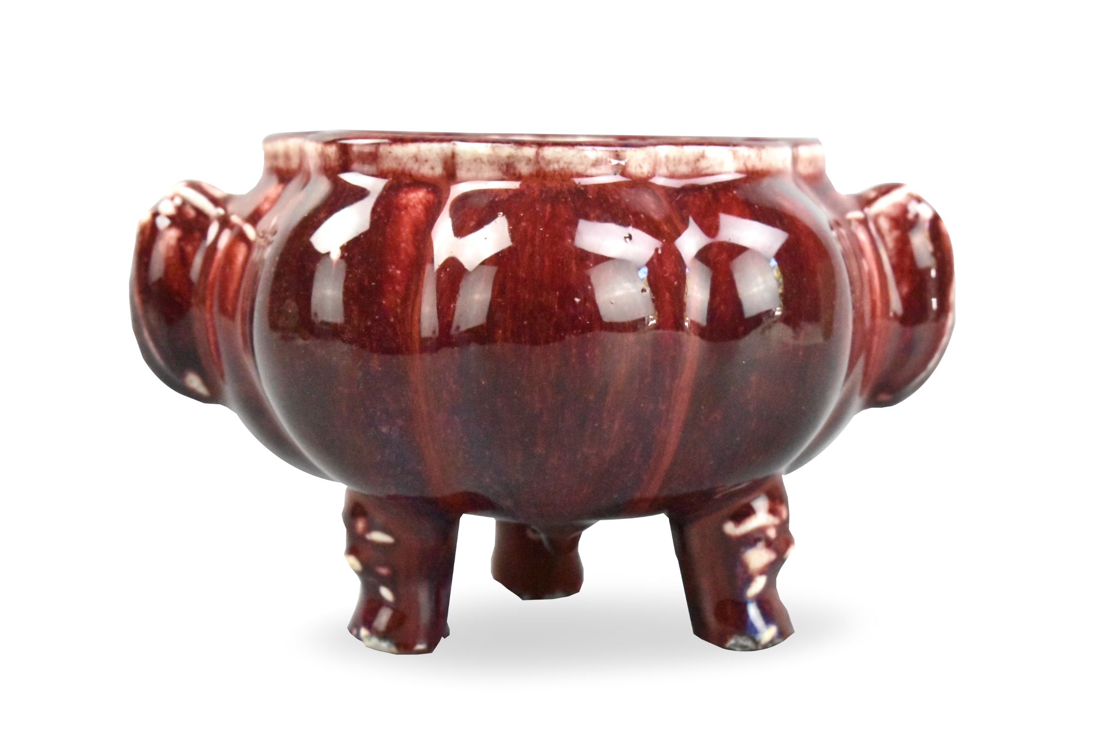 Appraisal: A Chinese flambe glazed tripod censer dating from the th