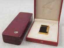 Appraisal: A Dupont gold plated Laque du Chine lighter in presentation