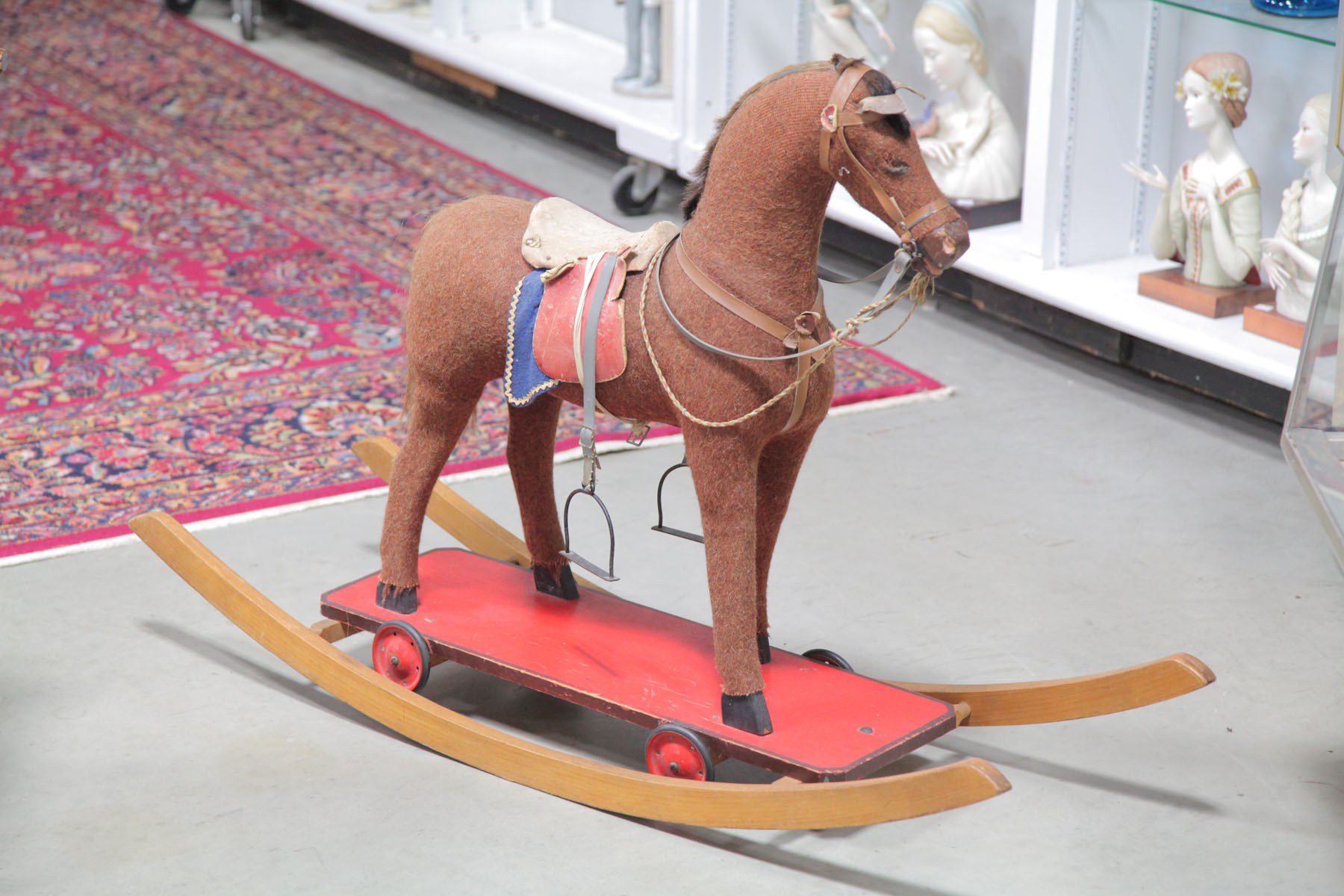 Appraisal: COMBINATION ROCKING HORSE AND PULL TOY Early th century Horse