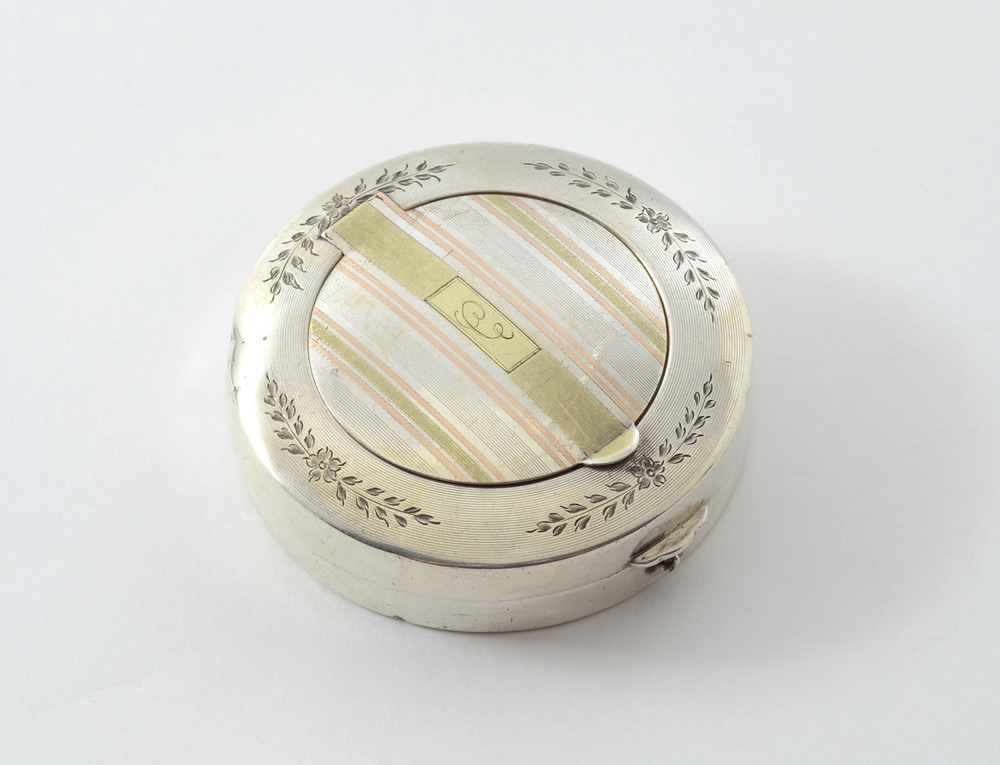 Appraisal: WATROUS CIRCULAR STERLING AND GOLD COMPACT Engraved top rim hinged