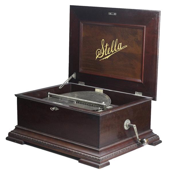 Appraisal: Stella music box early th C Mahogany case with twenty-one