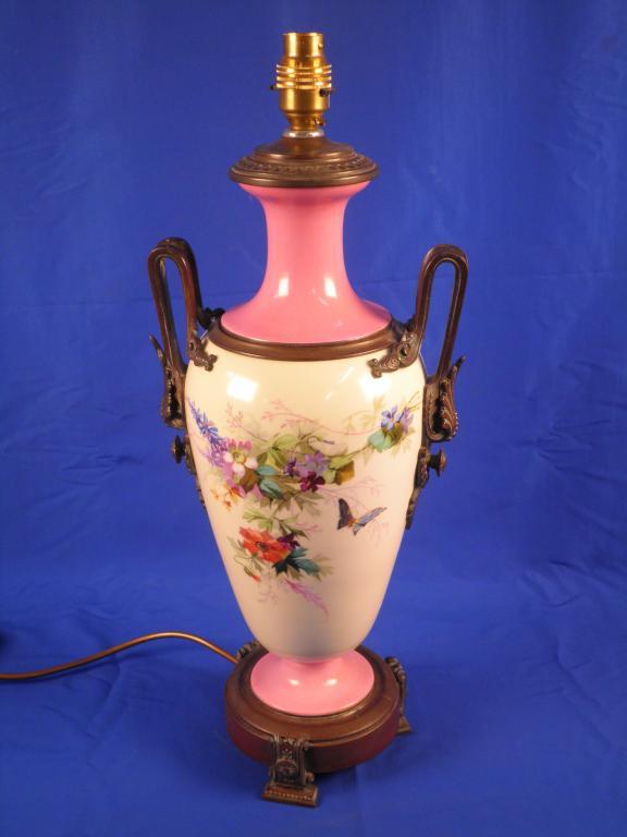 Appraisal: A Victorian pink and cream opaque glass table lamp with