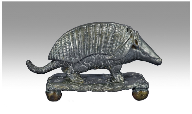 Appraisal: Pewter Match Striker Realistically Modelled As An Armadillo Raised On