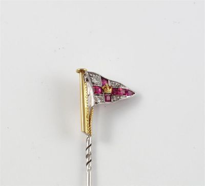 Appraisal: A ruby and diamond burgee stickpin