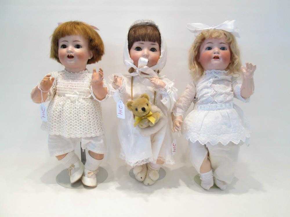 Appraisal: THREE GERMAN BISQUE HEAD DOLLS the first blond doll marked