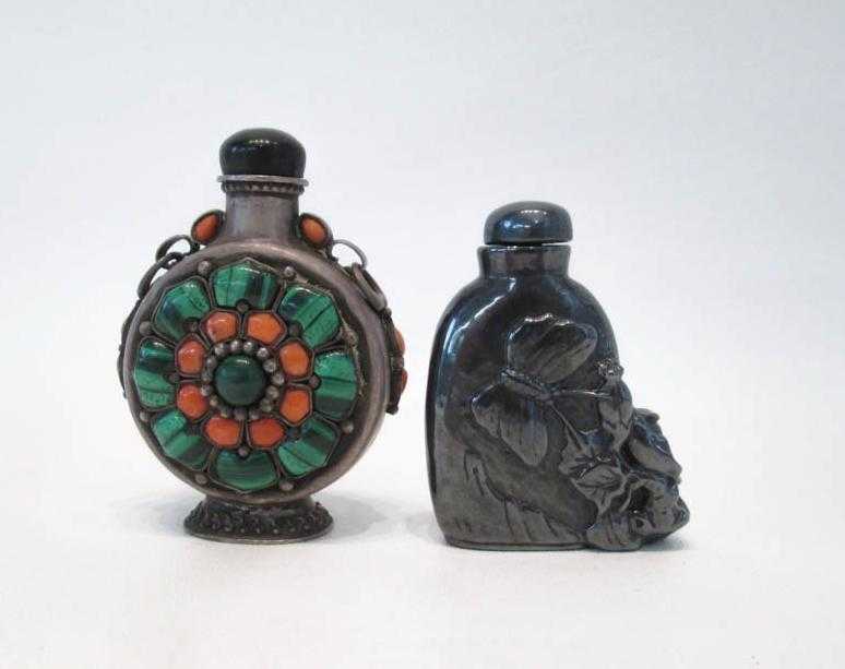 Appraisal: TWO SILVERED METAL SNUFF BOTTLES footed and flattened circular form