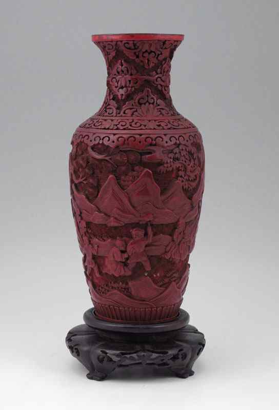 Appraisal: CINNABAR VASE Carved landscape with figures Base has been removed