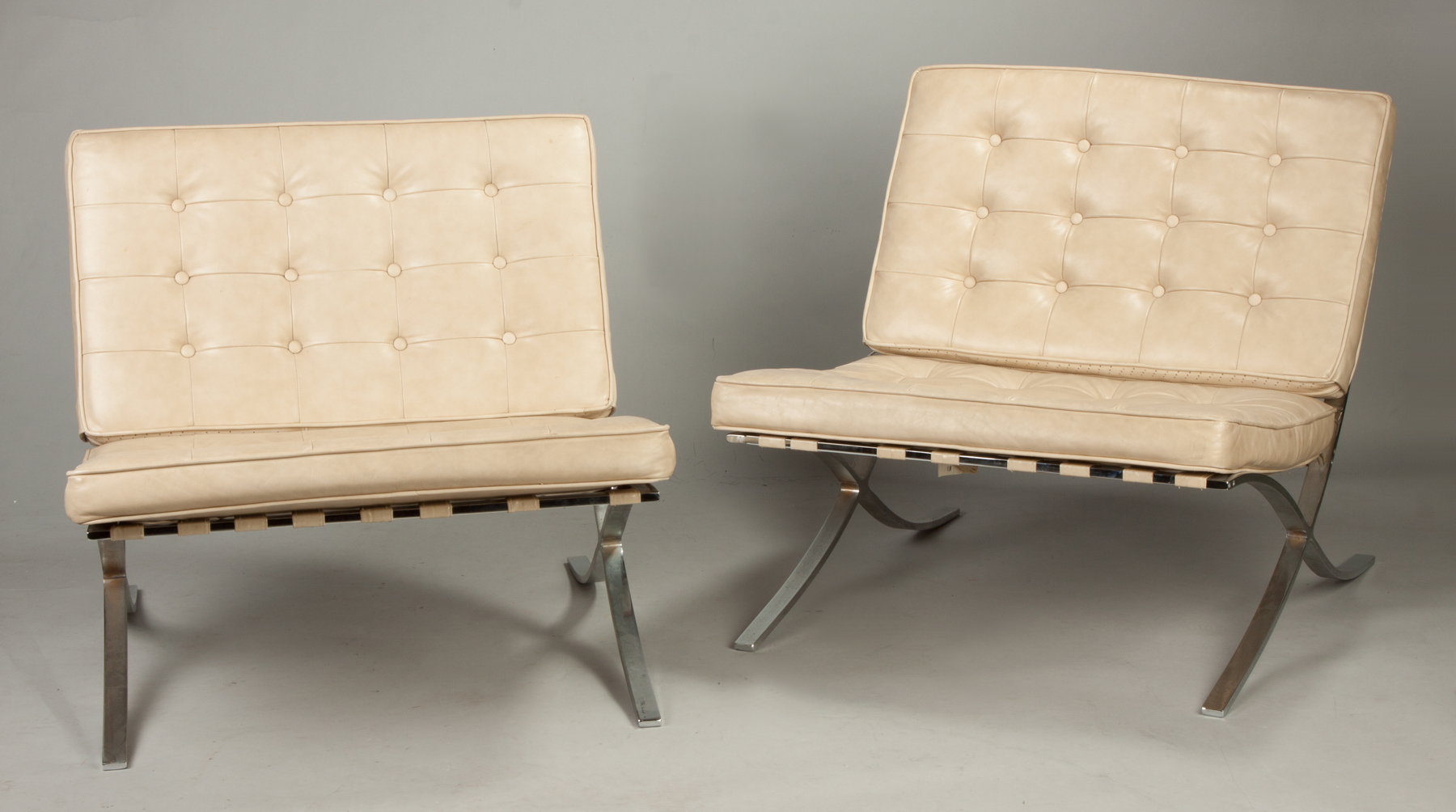 Appraisal: A Pair of Barcelona Chrome Plated Steel and Leather Chairs