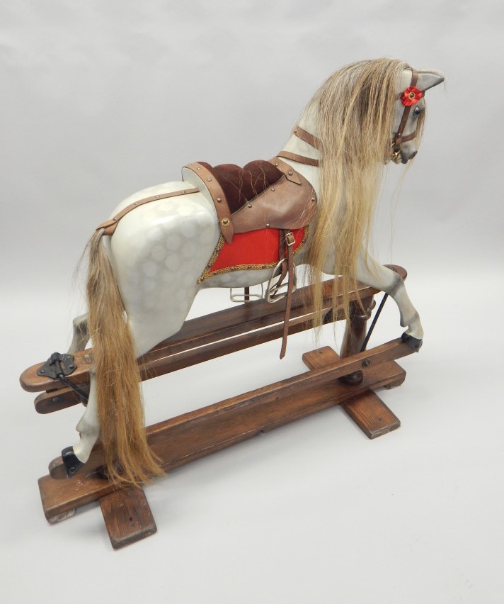 Appraisal: An early thC Lines Limited dapple grey rocking horse with