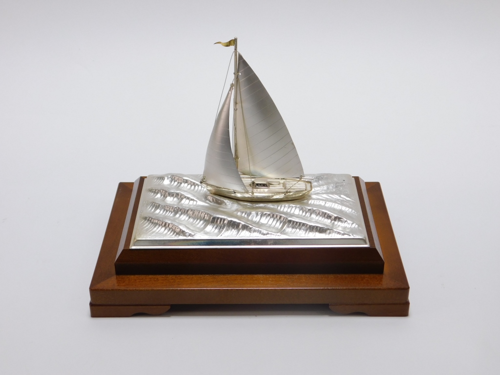 Appraisal: TAKEHIKO SEKI SILVER SAILBOAT SCULPTURE Japanese th CenturyDepicts a small