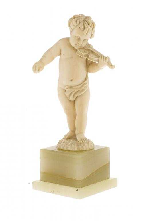 Appraisal: A CONTINENTAL IVORY STATUETTE OF PUTTO PLAYING THE VIOLIN BY