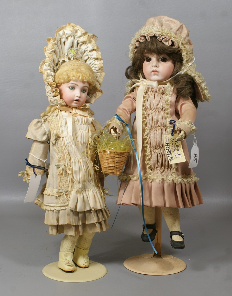 Appraisal: Reproduction Bru dolls larger with brown eyes is on a