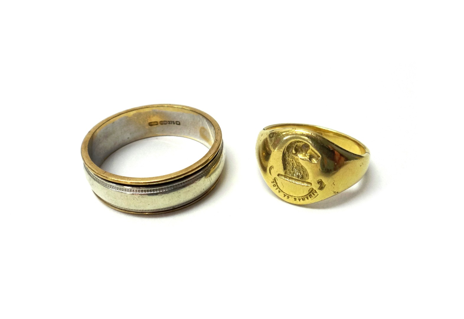 Appraisal: A ct gold two part ring with moving band ring