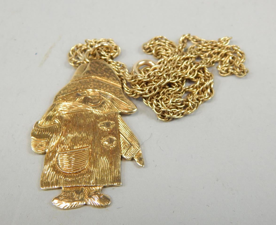 Appraisal: A ct gold Paddington Bear charm pendant attached to a