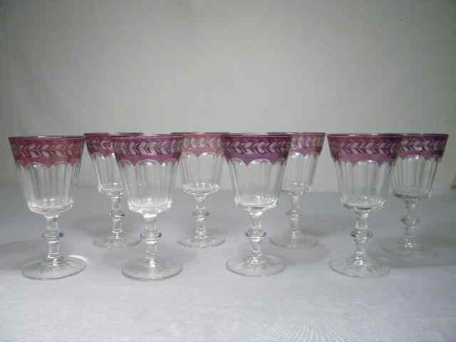 Appraisal: Eight etched amethyst-colored flashed-glass wine stems Amethyst flashed rims with