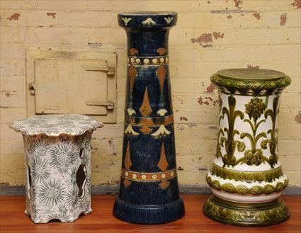 Appraisal: TWO VICTORIAN MAJOLICA LOW PEDESTALS One pedestal with Egyptian-style decoration