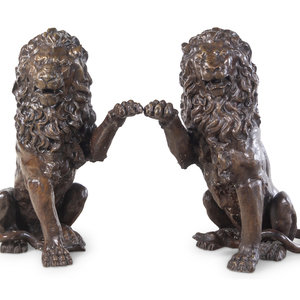 Appraisal: A Pair of Patinated Bronze Lions th Century Height x