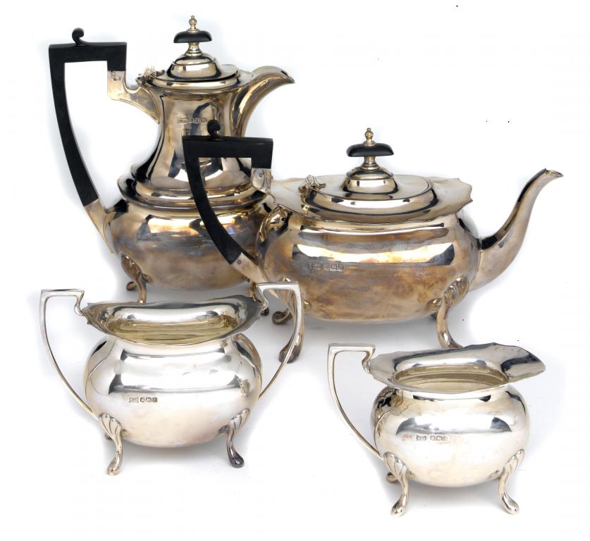 Appraisal: A GEORGE V FOUR-PIECE TEA SERVICE of oblong form on