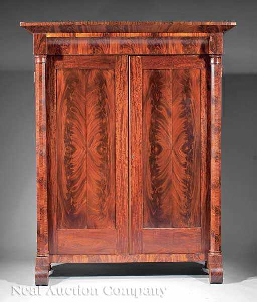 Appraisal: An American Late Classical Figured Mahogany Armoire c flared cornice