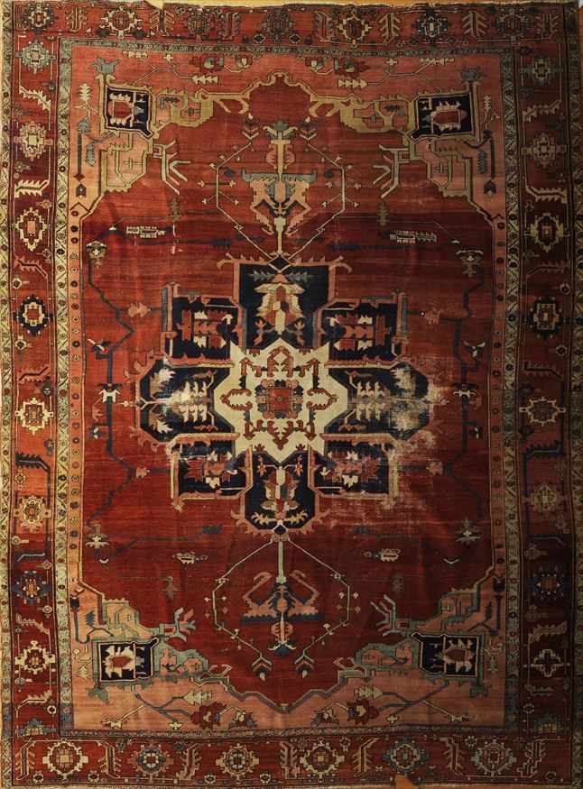 Appraisal: PERSIAN HERIZ CARPET Woven with a central blue medallion with